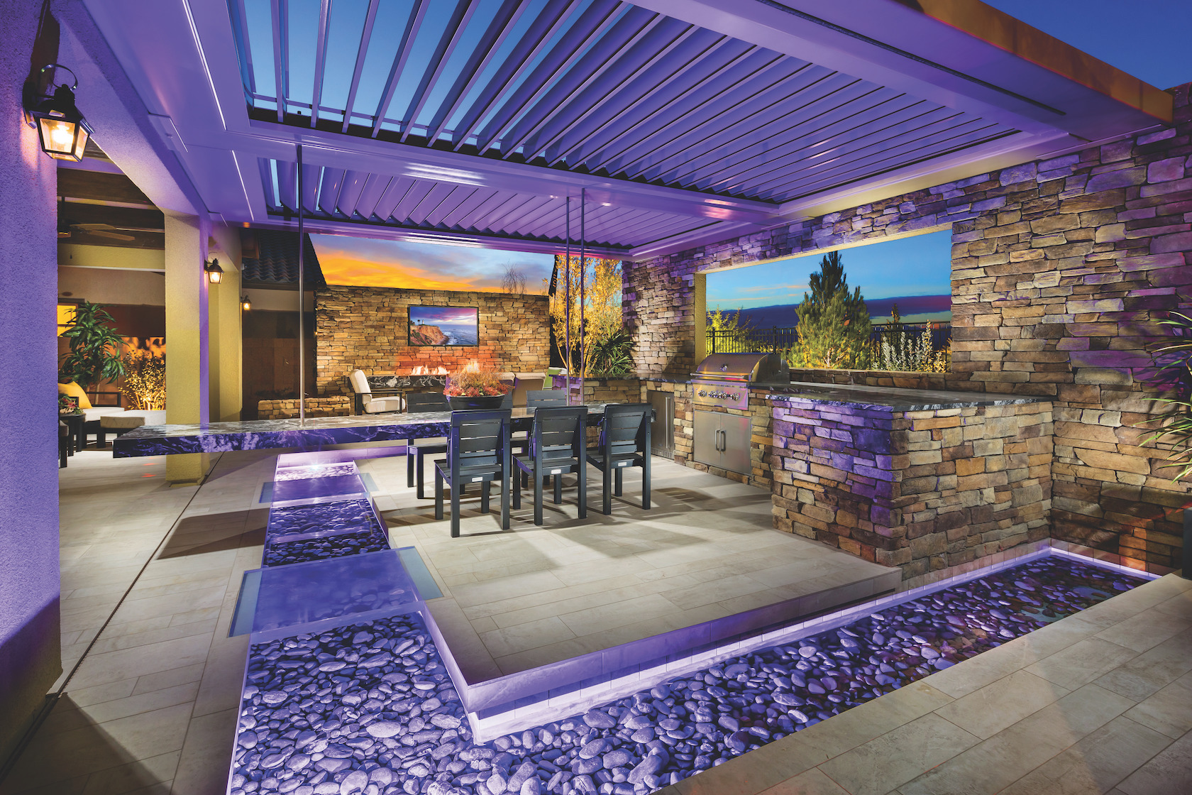 Tremendous outdoor dining space with purple accent lighting