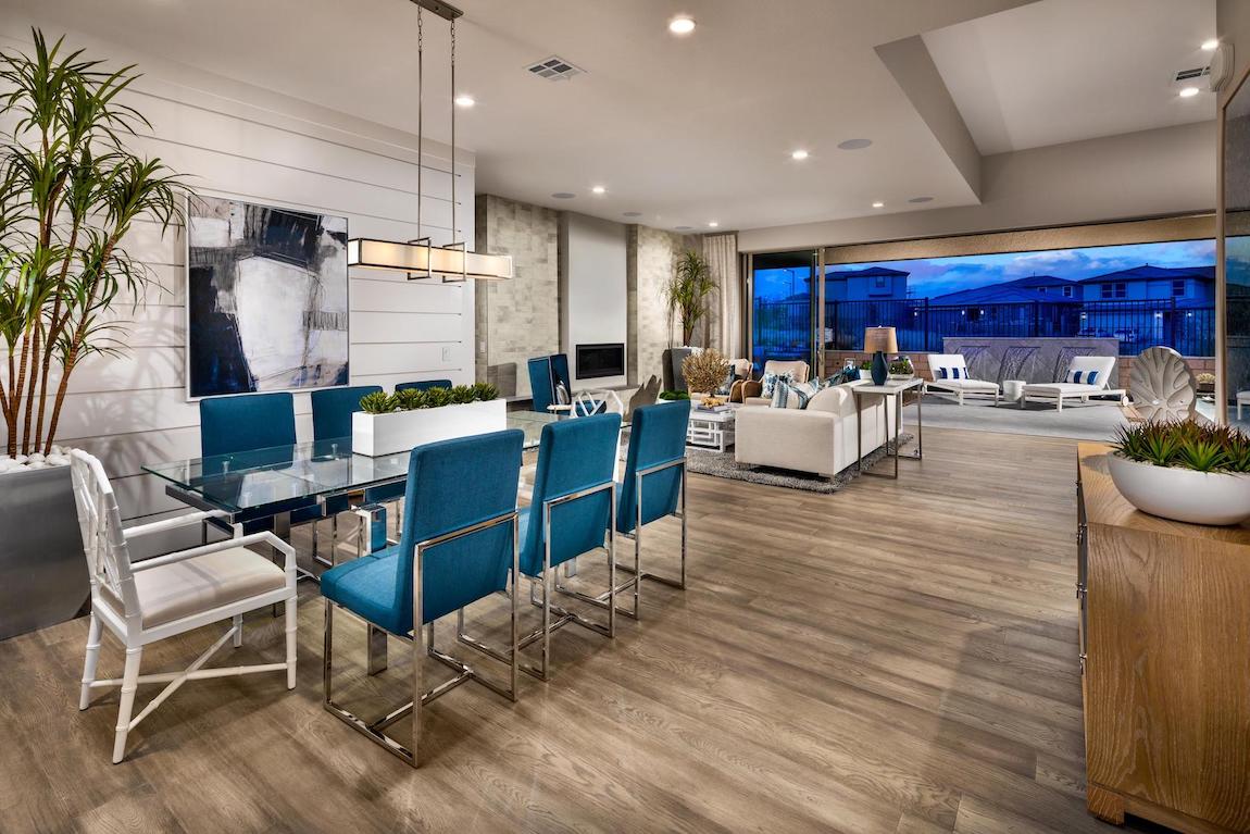 Open floor plan dining & entertainment space with shiplap walls.