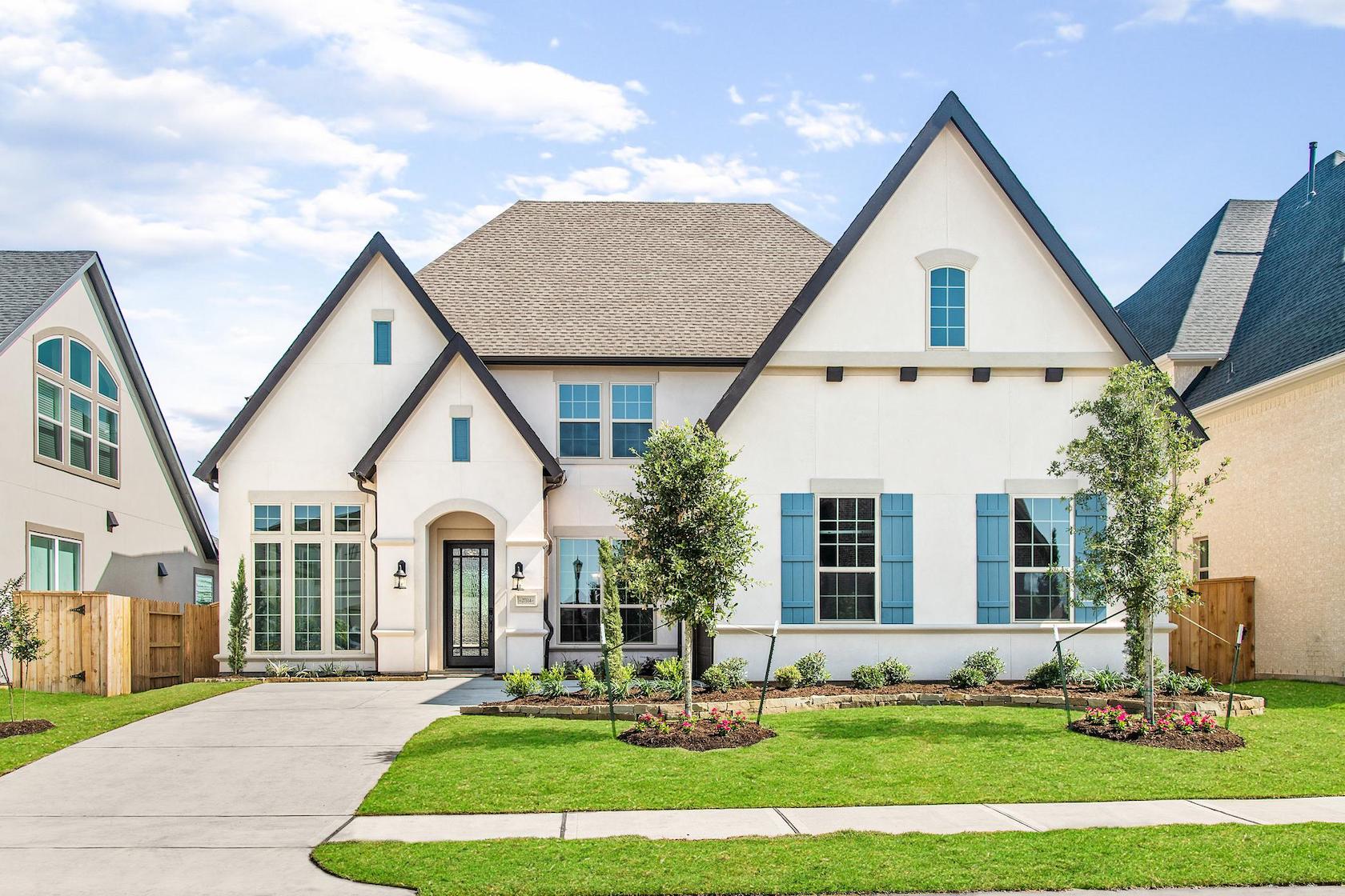 White front exterior with teal window shutters