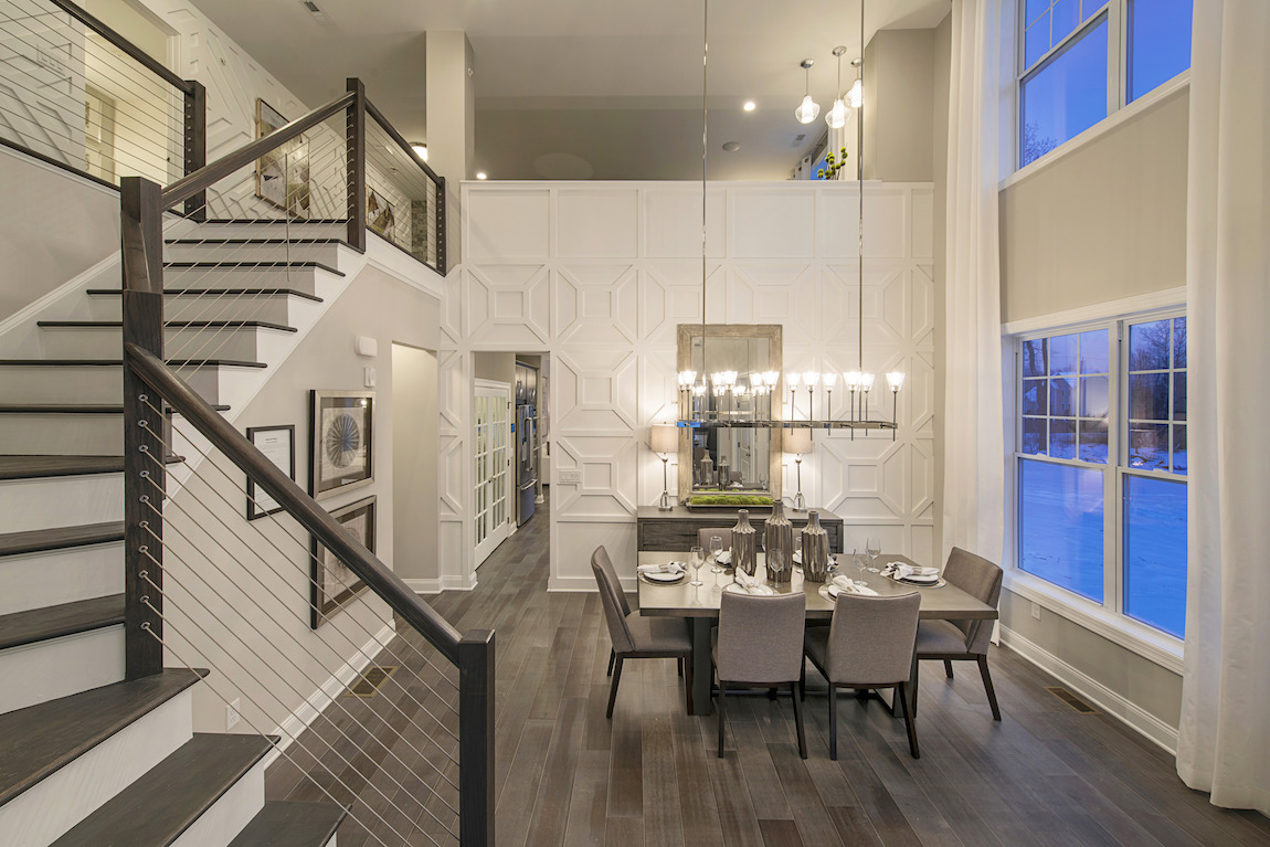 Luxury dining room featuring soft, neutral theme that incorporates complimentary transitional design.