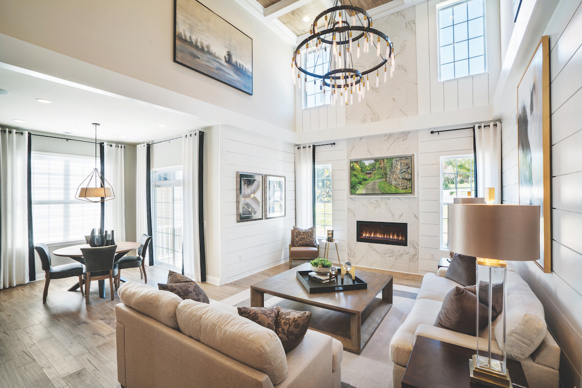 Two story great room with shiplap walls