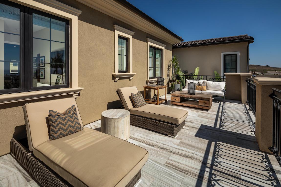 Luxury deck with lounge seating and iron railing