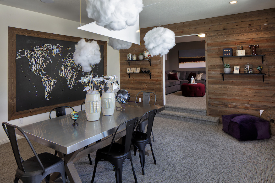 Rustic dark wood walls in a dining space.