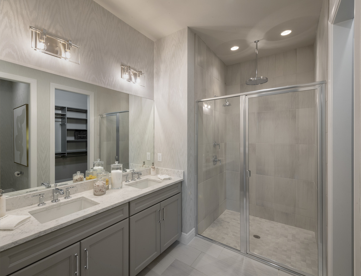 Large vanity with sizable mirror and two sinks. 