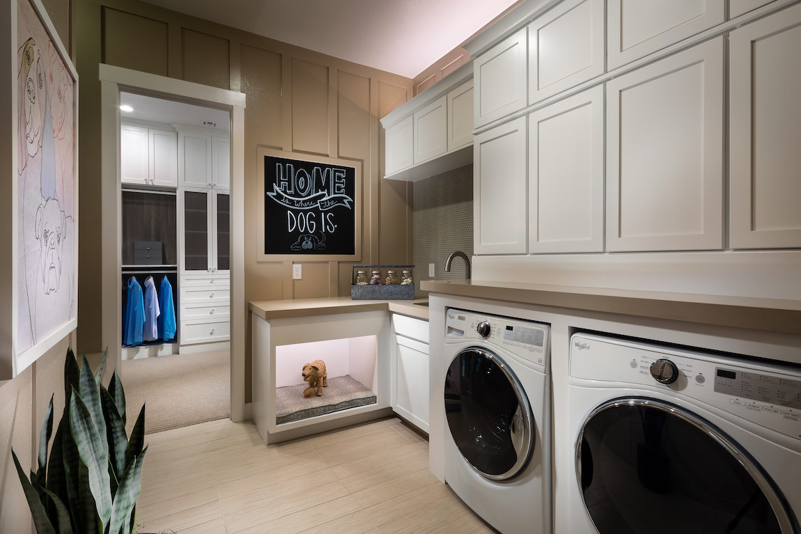 Laundry room with dog area, blackboard, and accent lighting