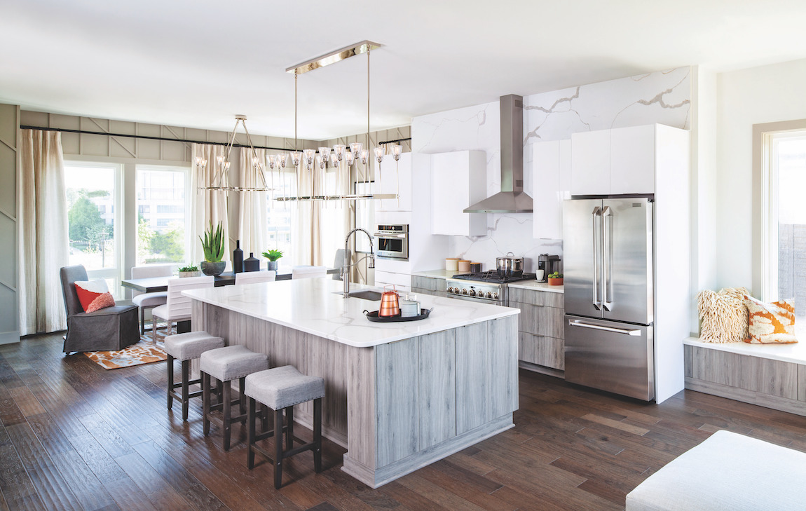Kitchen full of natural lighting highlighted by exquisite pendant fixture