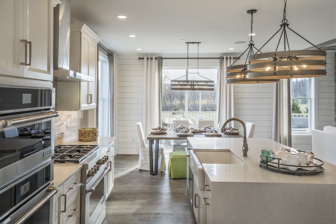 Kitchen with breakfast area and white countertops.
