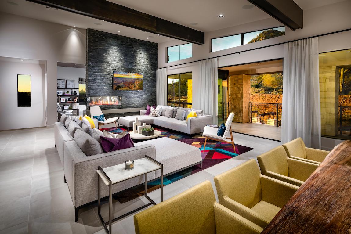 Spacious great room elevated by shades of yellow and other vibrant colors