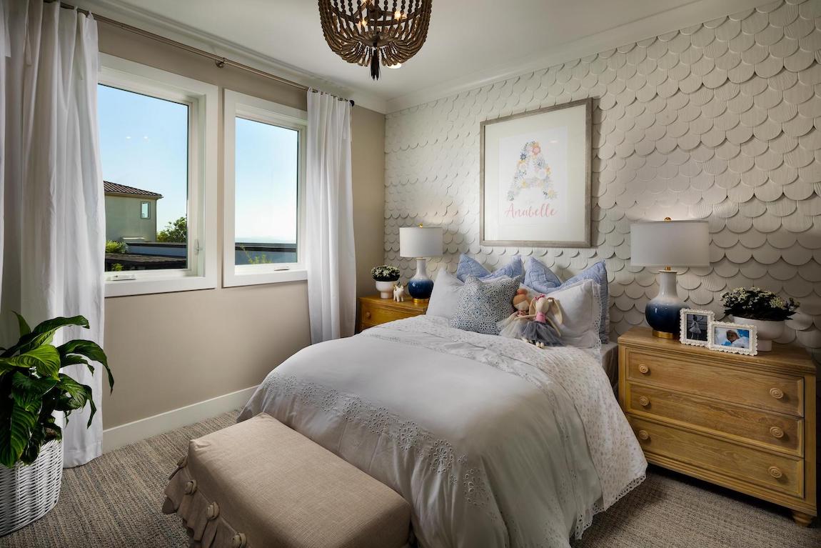 Girl's bedroom accent wall with white scallop wall pattern