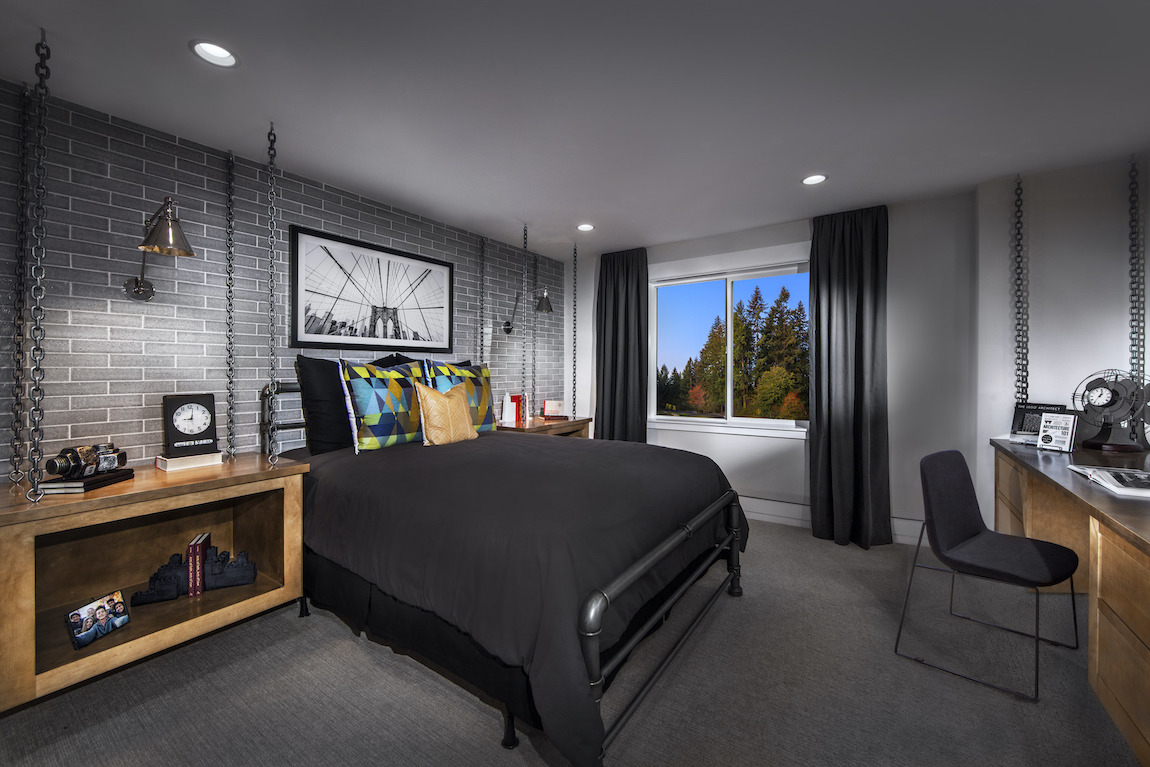 Industrial designed bedroom with ceramic tile accent wall and chain decor.
