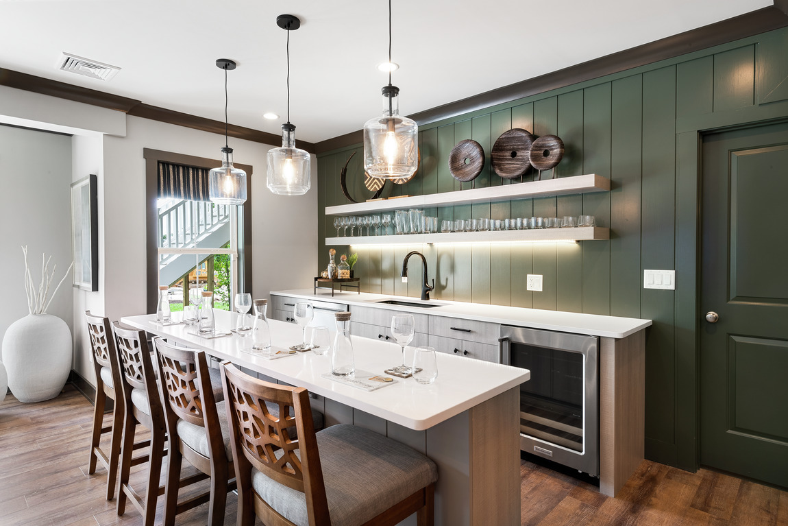 Kitchen with white quartz countertop and green pastel accent wall