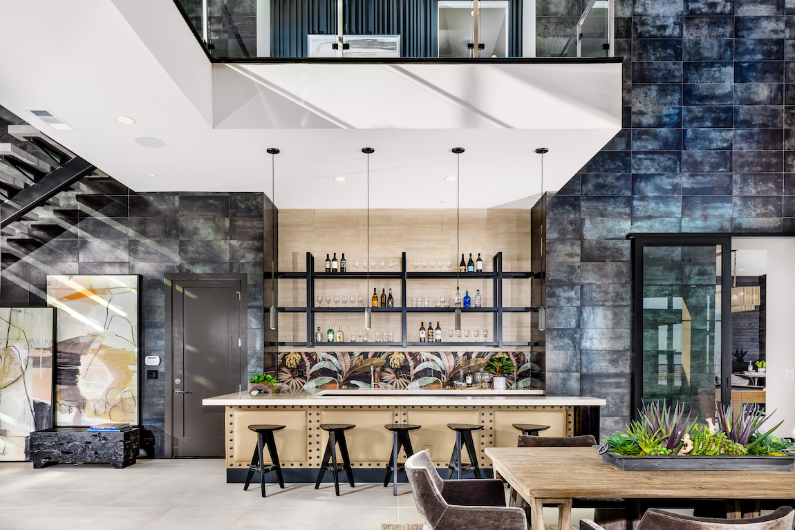 Great room with aluminum accent wall featuring an airplane theme