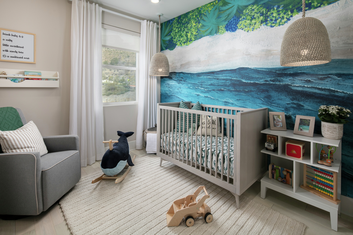 Nursery with colorful wallpaper, crib and neutral tones