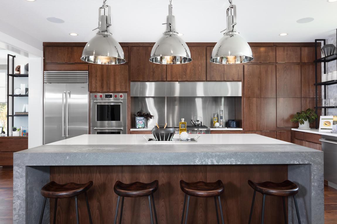 Luxury kitchen with modern home technology such as a smart fridge and cooktops.