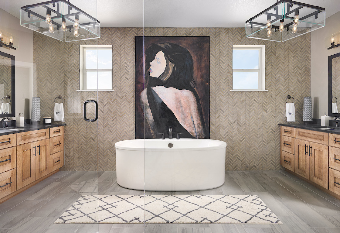 Bathroom with tile accent and mural with freestanding tub
