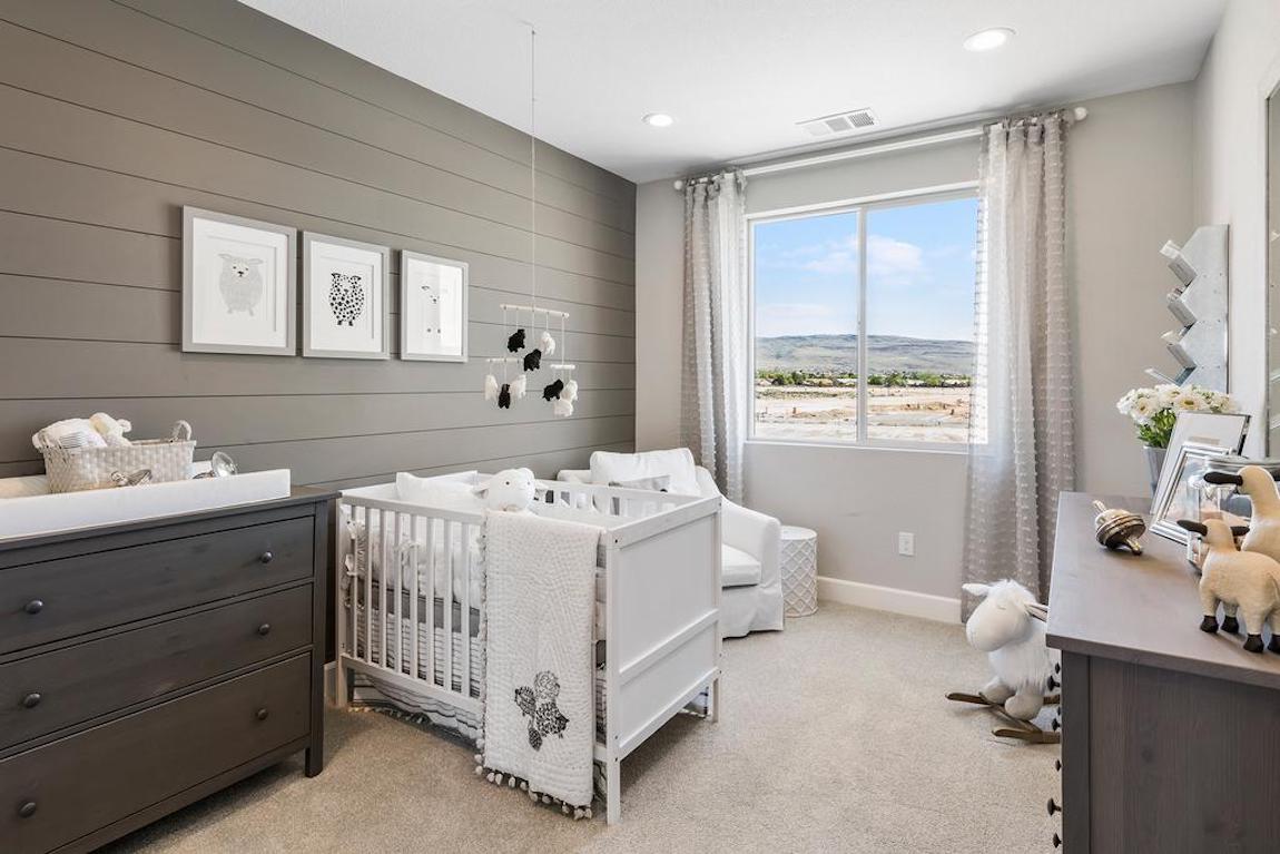 Nursery with gray statement shiplap wall.