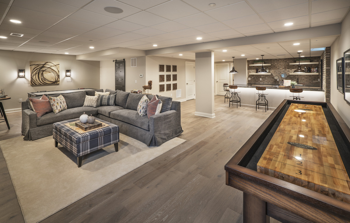 Grand basement featuring lounge, game area, and home bar