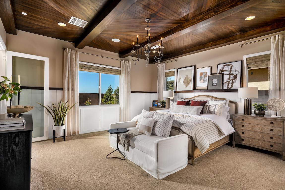 Master bedroom highlighted by wood beams and ceiling