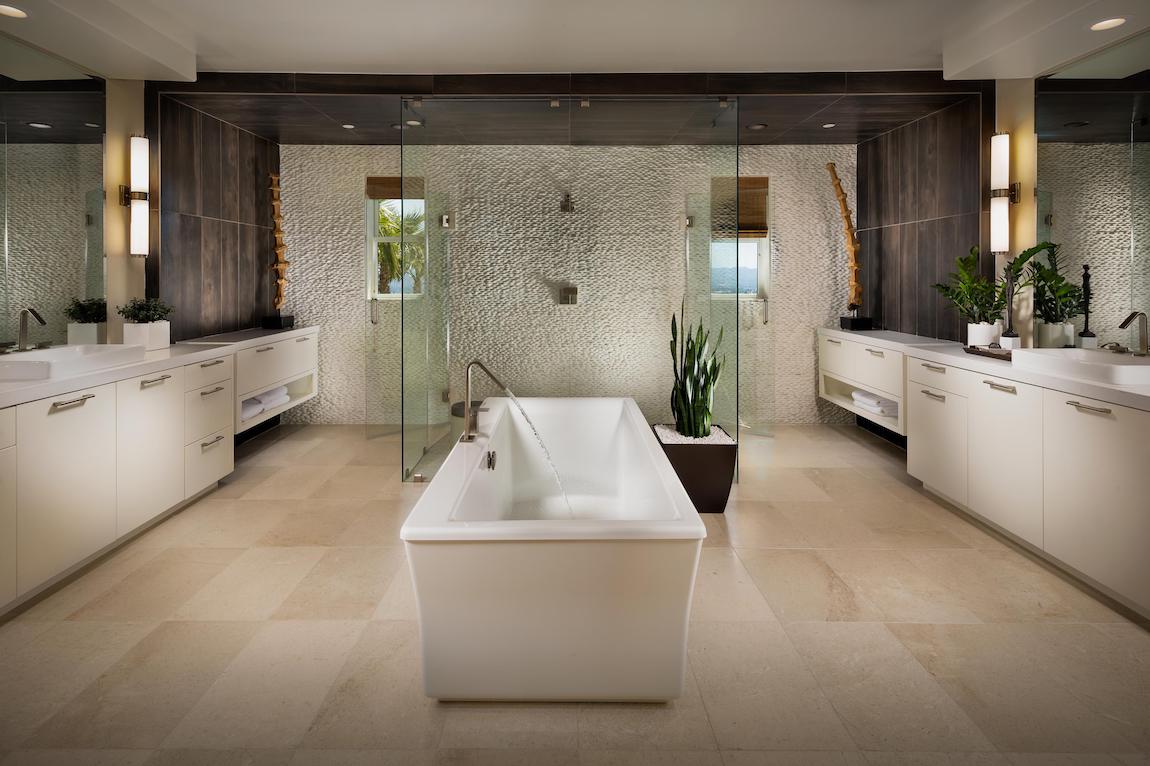 Luxurious master bathroom featuring focal freestanding tub and dramatic walk-in shower.