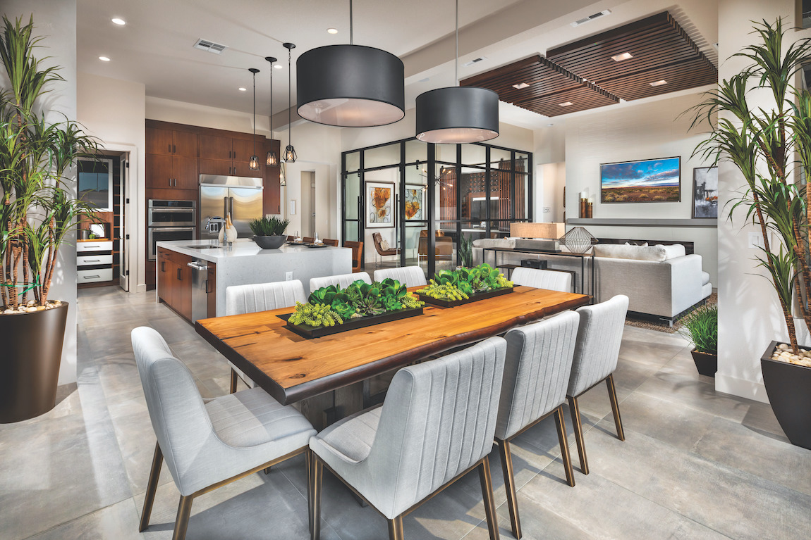 Modern luxury home with an open floor plan merging the kitchen, dining room, and living room.
