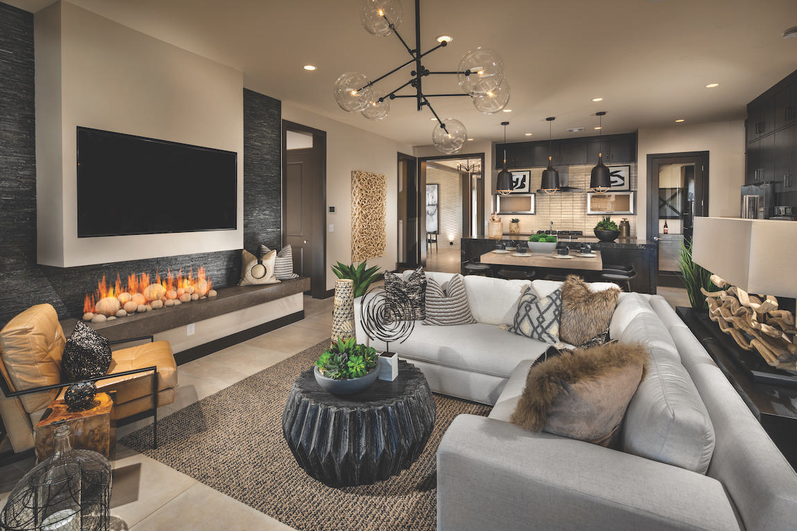 Modern great room with innovative fireplace and lighting fixture