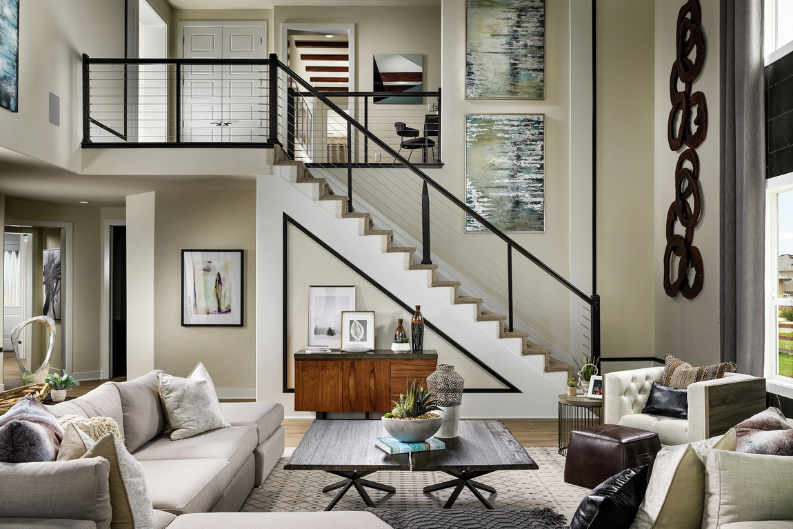 Modern staircase with white walls and black and wood accents.