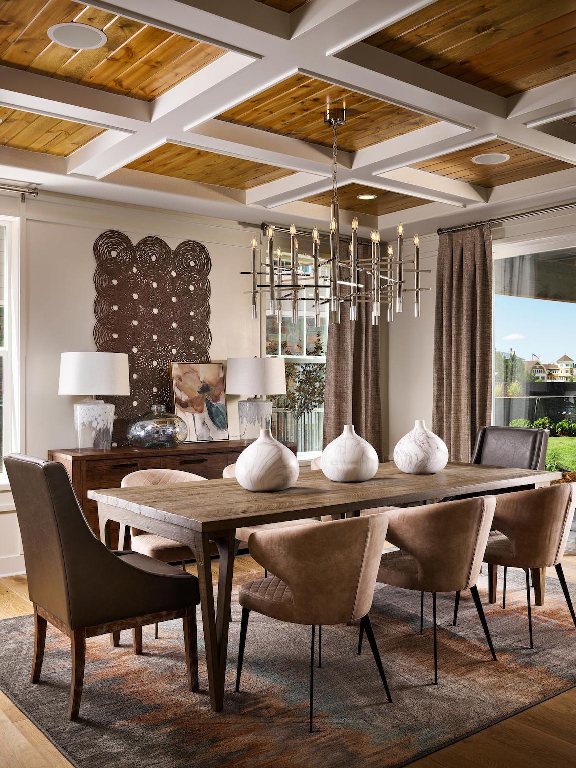 Striking dining room design featuring coffered ceiling