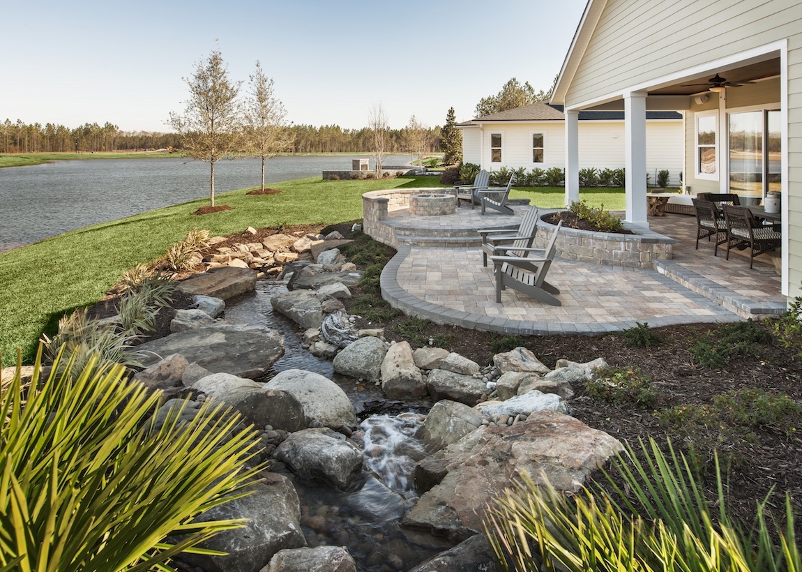 Lakefront outdoor space of a Toll Brothers Captiva model in Florida.