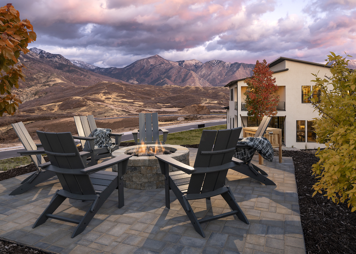 Fire pit in the backyard of a Toll Brothers model home with mountain views at Toll Brothers at Edelweiss in Utah.