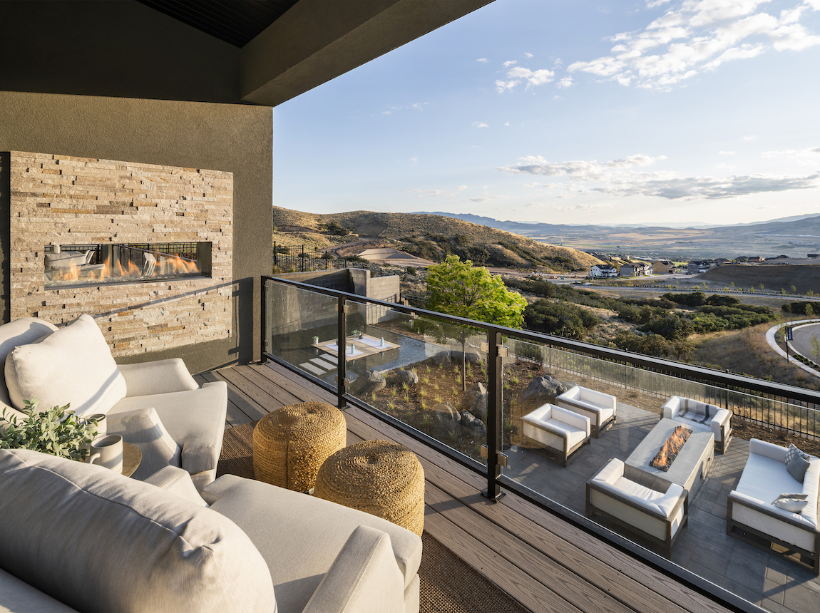 Outdoor deck in a Toll Brothers model home in Utah overlooking mountains.