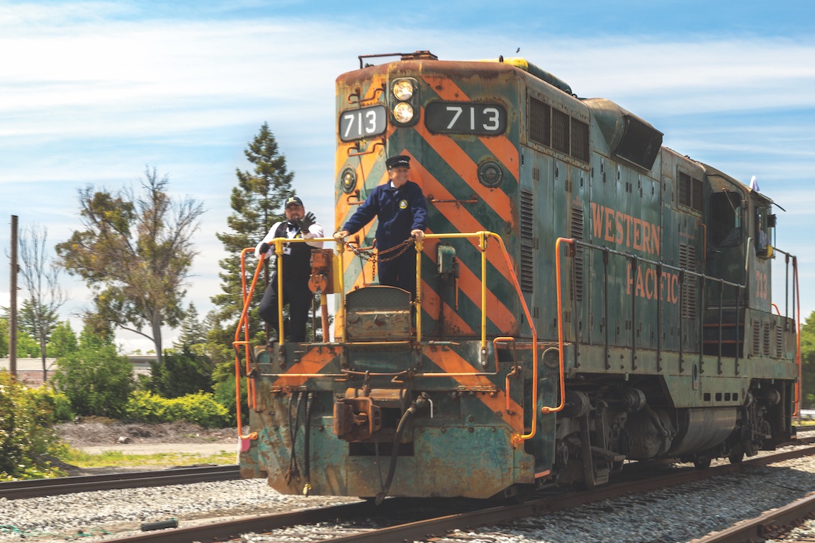 Train with conductor and engine operator.