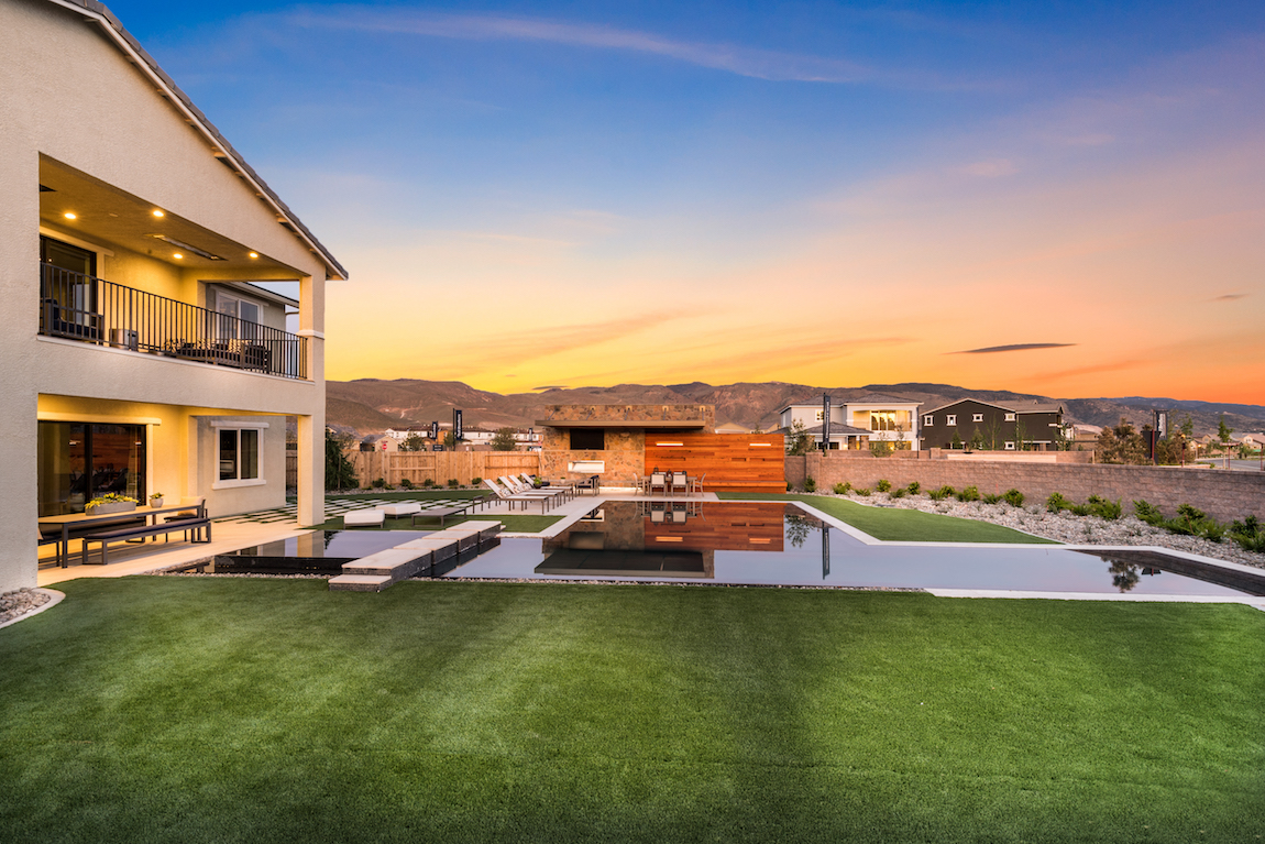 Toll Brothers model home in Nevada overlooking mountains during sunset. 