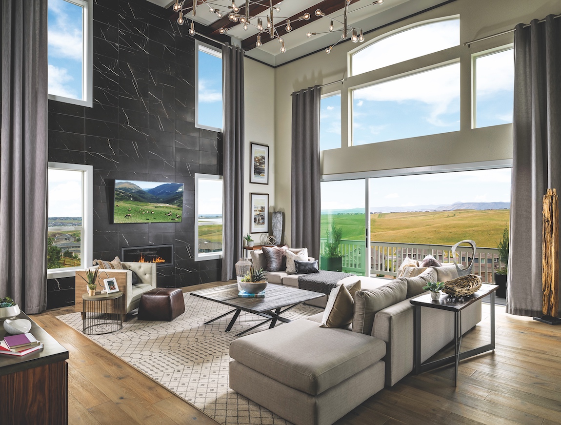 Toll Brothers model home in Toll Brothers at Candelas in Colorado with views of surrounding nature.