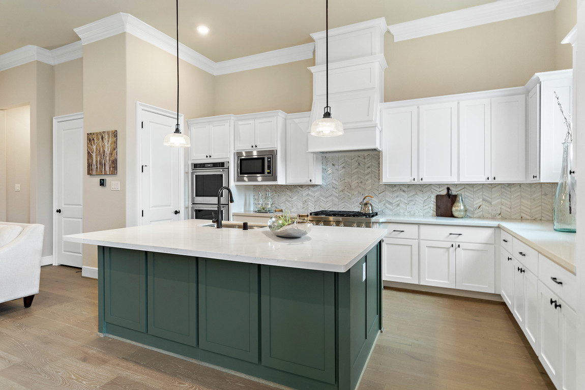 Luxe kitchen design featuring green island