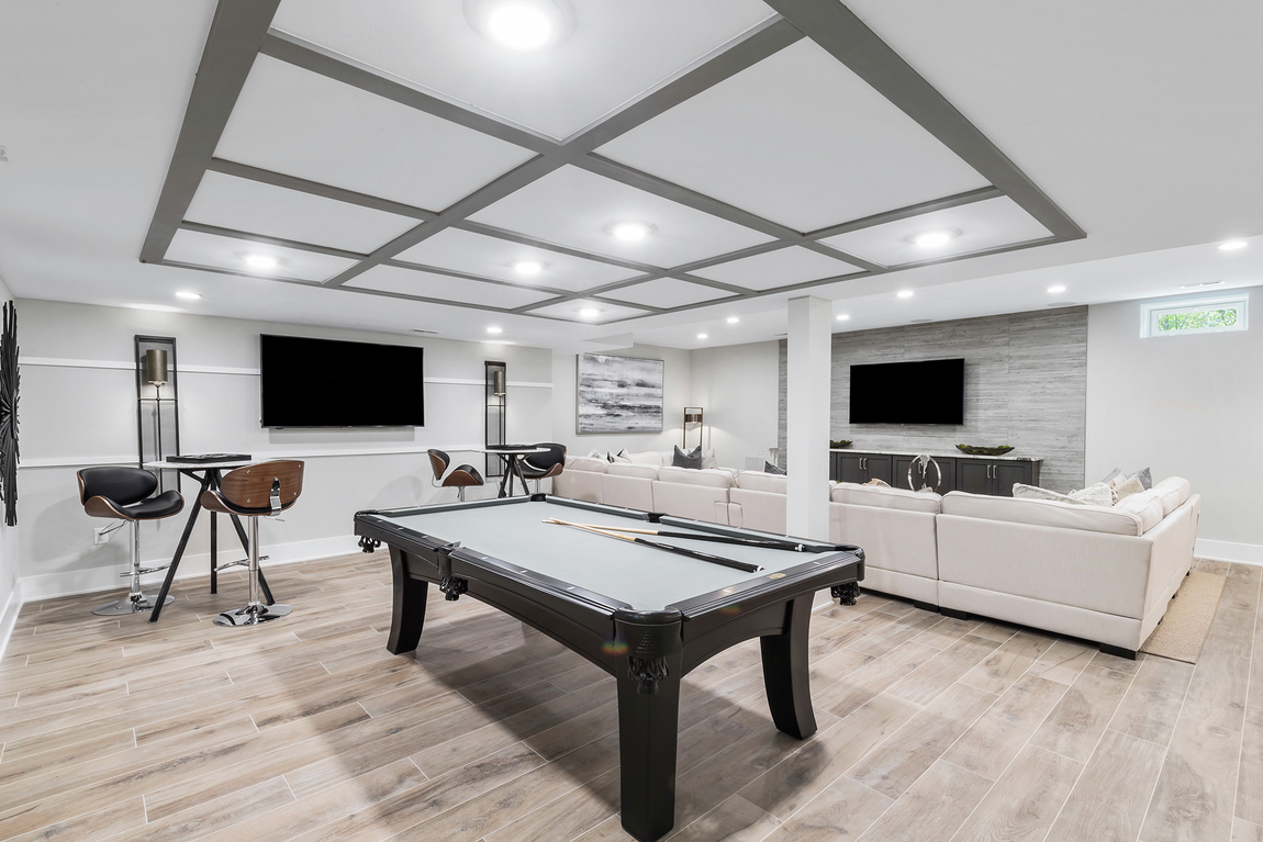 Expansive basement with entertainment area