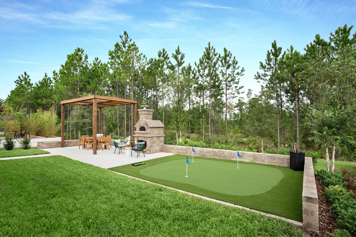 Luxe backyard highlighted by putting green