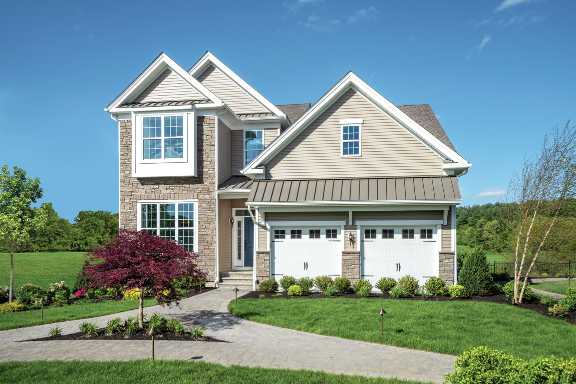 Exterior of a new construction Toll Brothers Farmington model home in Massachusetts 