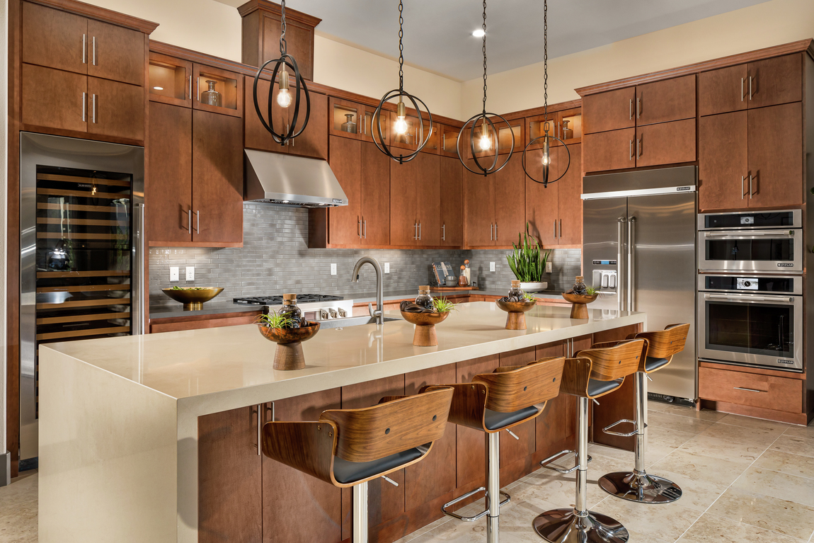 Luxury modern kitchen with tan quartz island countertop