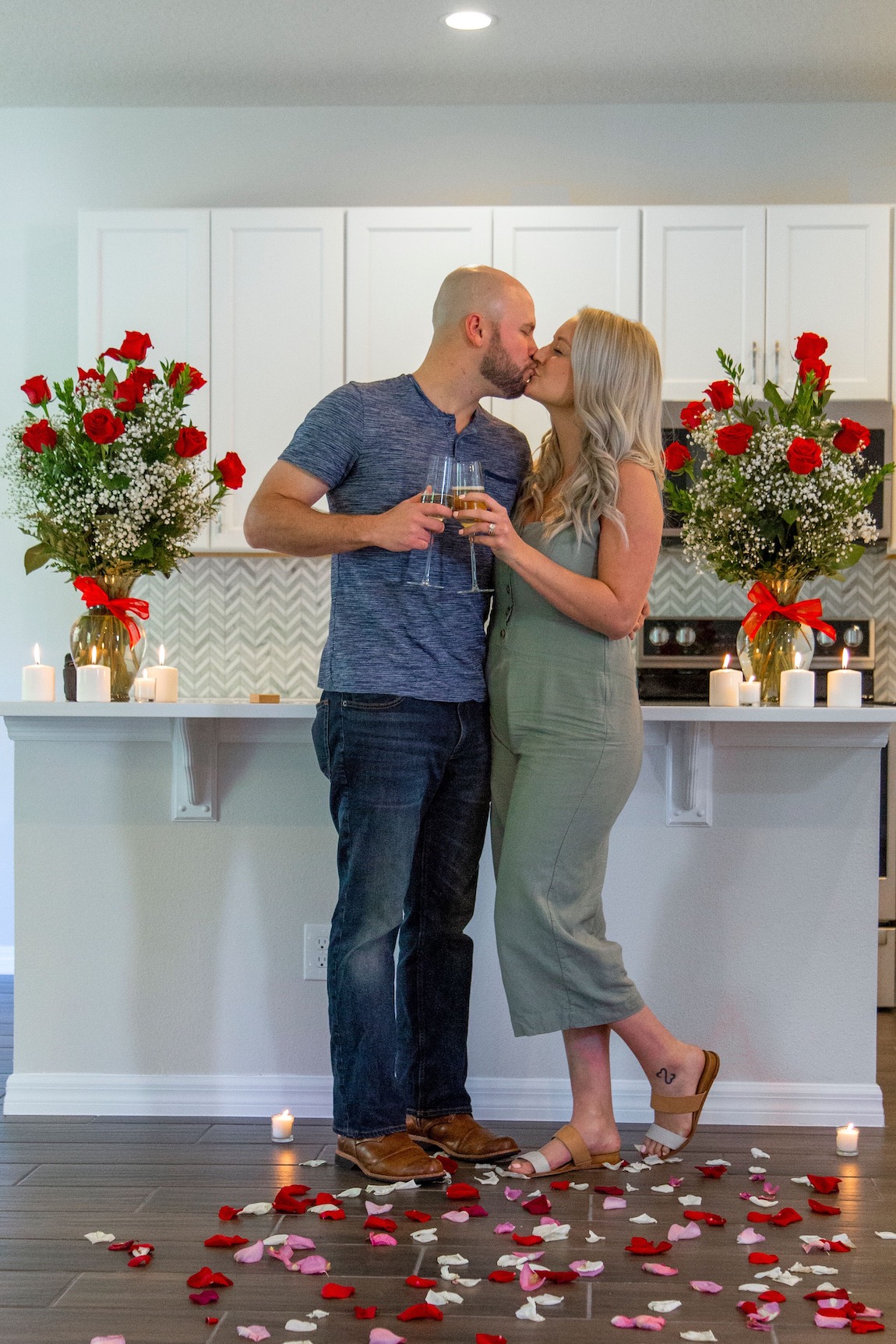 Couple celebrating their surprise engagement in their new Toll home