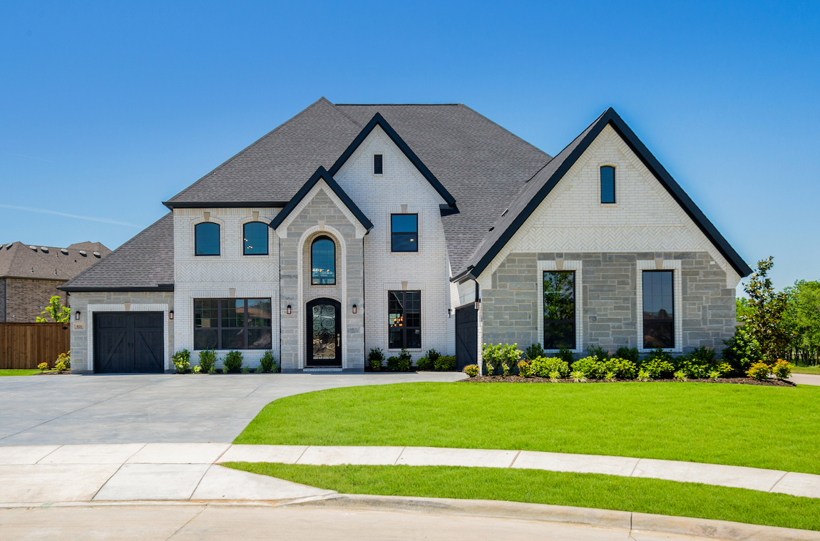 Exterior of a new construction Toll Brothers Bellwynn model home in Dallas Forth Worth