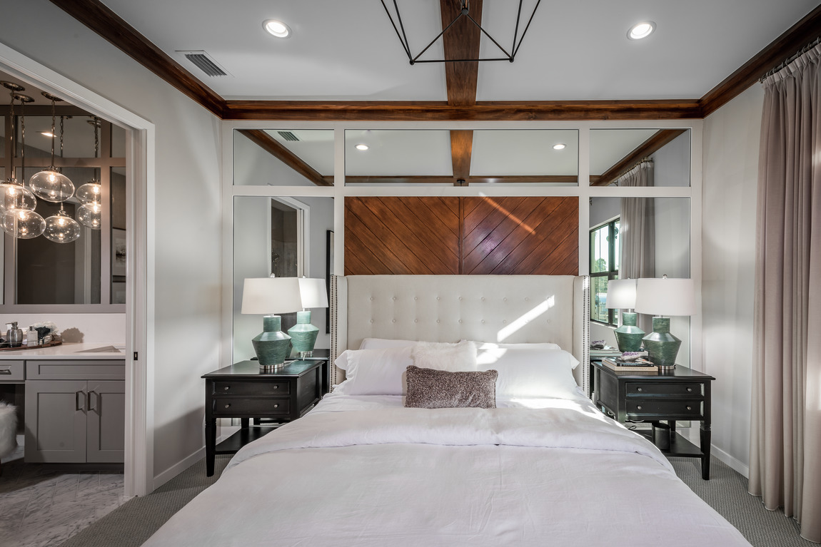 Bedroom with ceiling accent wood and mirror bed backboard