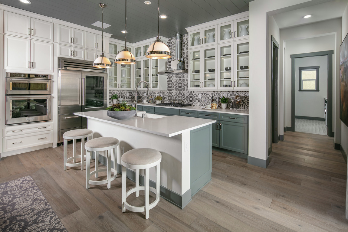 Luxe kitchen featuring intricate backsplash, a popular home design trend