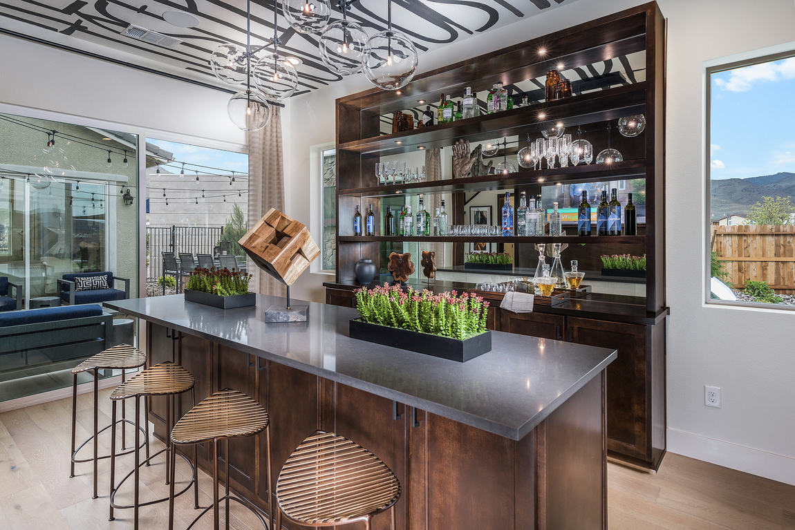 Bar with foiled black pattern ceiling, metallic glass hanging light fixtures and modern wood bar stools