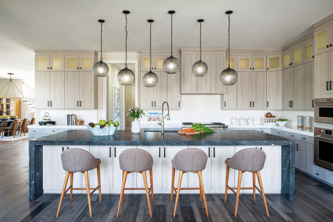 Luxury kitchen featuring island with ample storage space