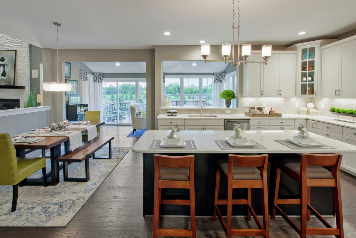 Transitional kitchen with classic wooden stools