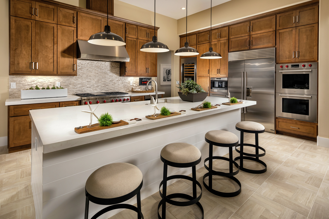 Warm, inviting modern farmhouse kitchen with circular bar stools.