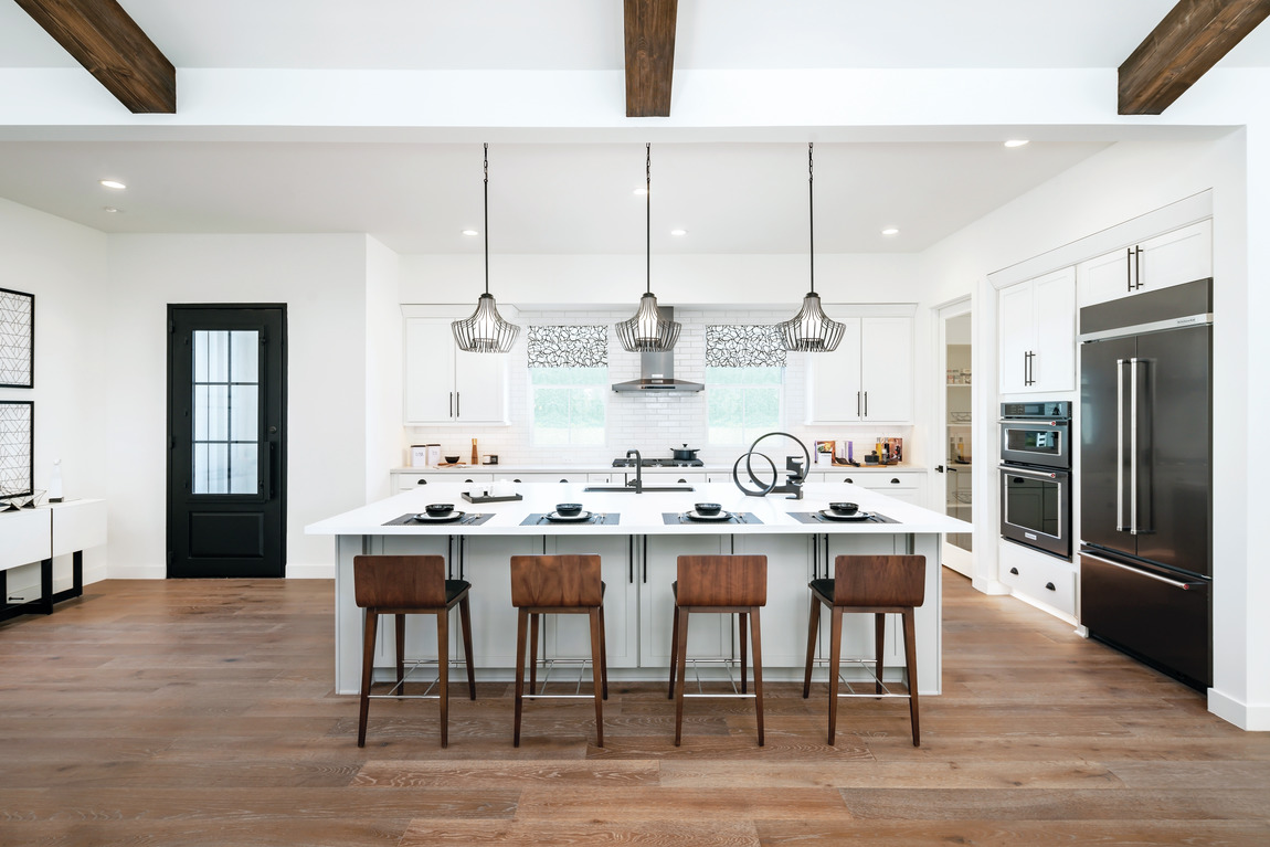 Modern farmhouse kitchen design with a large island.