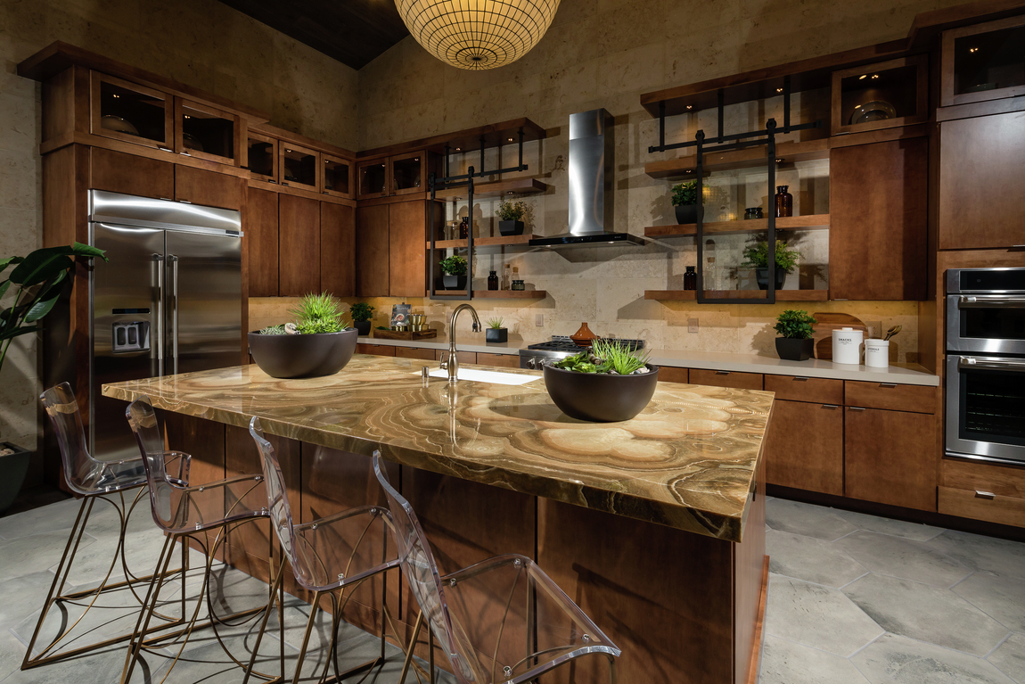 Beautiful waterfall island in dark toned kitchen