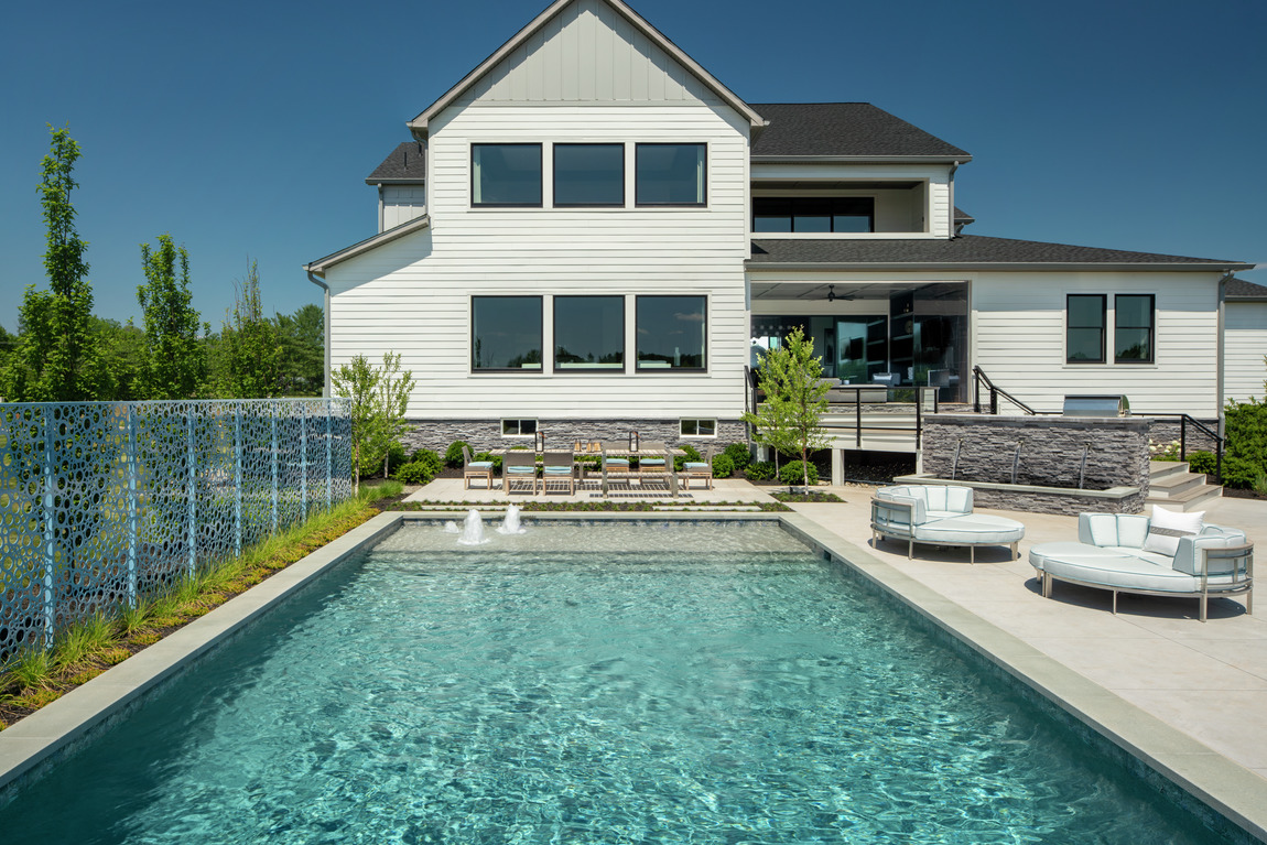 Backyard highlighted by luxe pool