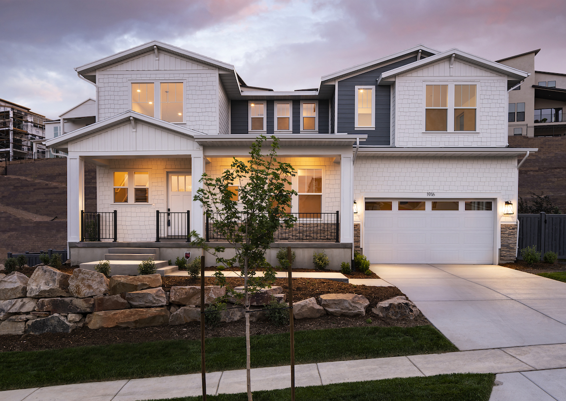 Exterior of a modern craftsman house with urban styling and a traditional front porch.